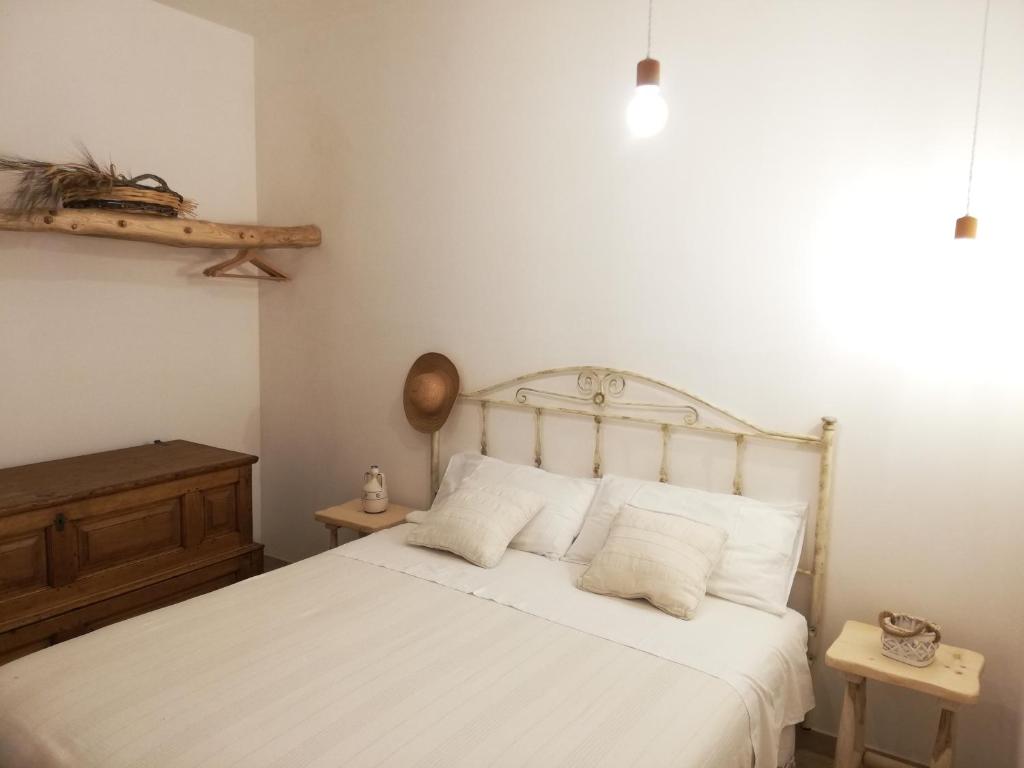 Łóżko lub łóżka w pokoju w obiekcie Trulli Bosco Selva