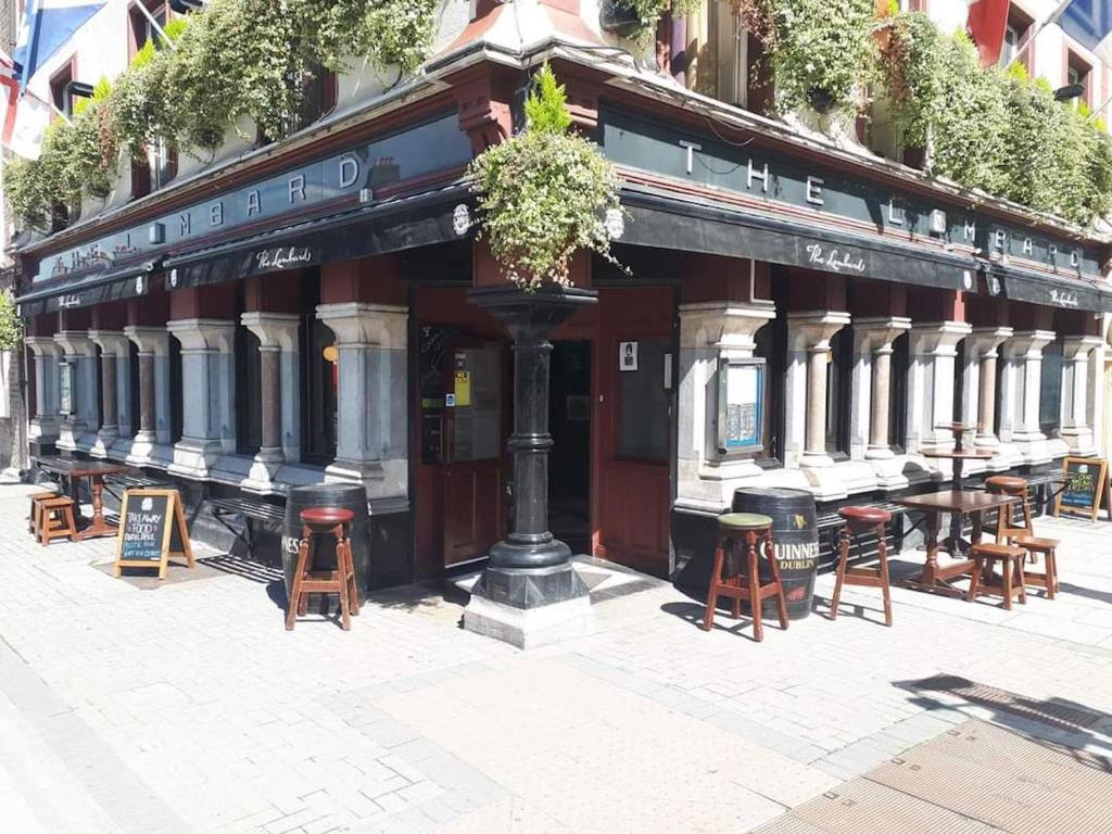 a restaurant with tables and chairs in front of it at The Lombard Townhouse in Dublin