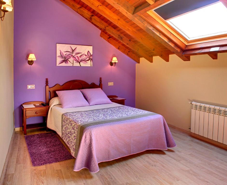 Postel nebo postele na pokoji v ubytování Hotel L´Alloru