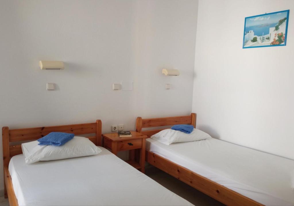 Postel nebo postele na pokoji v ubytování Ammosis Inn