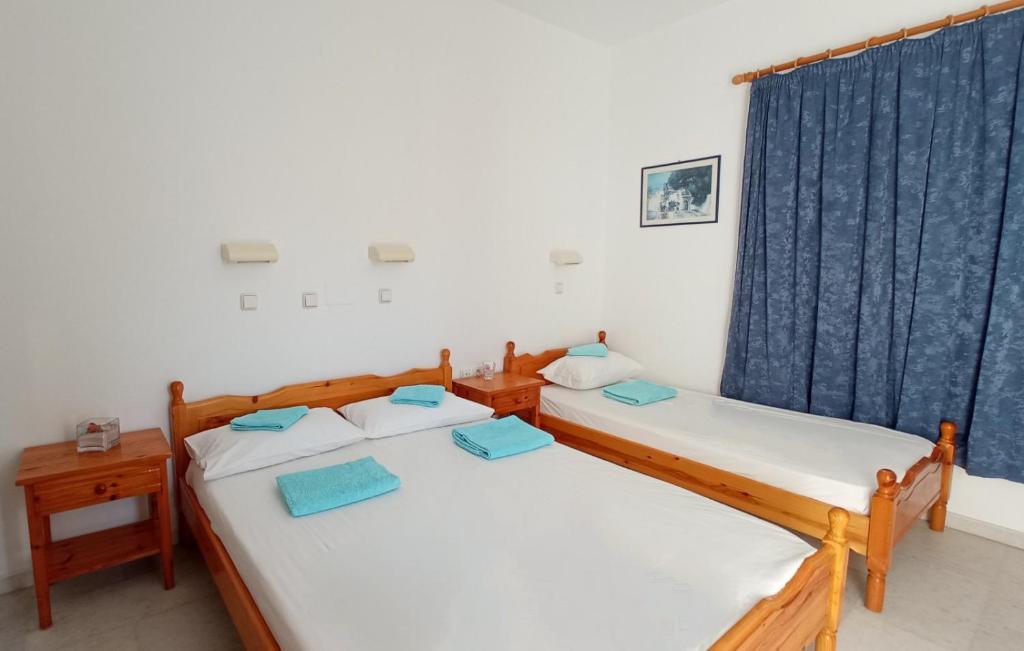 Postel nebo postele na pokoji v ubytování Ammosis Inn