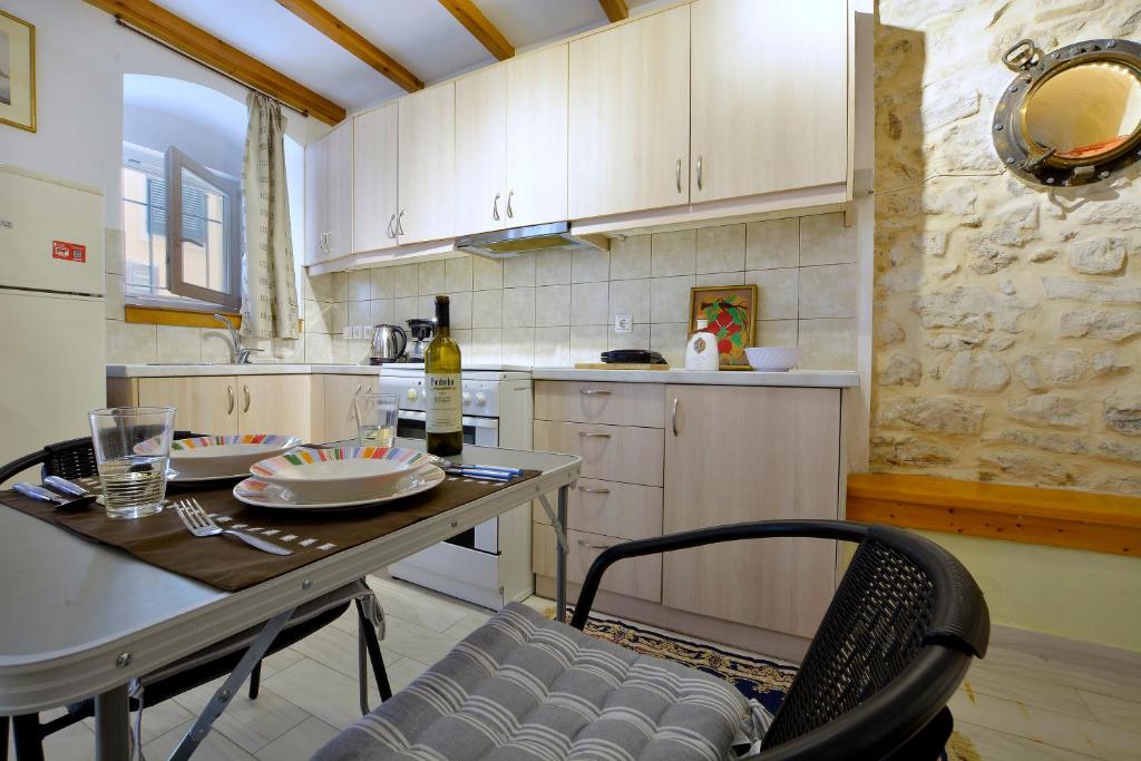 A kitchen or kitchenette at Studio in Corfu town