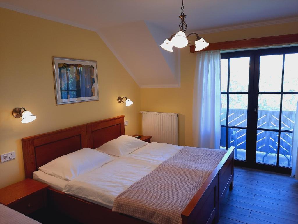 Postel nebo postele na pokoji v ubytování Turistična Kmetija Puklavec