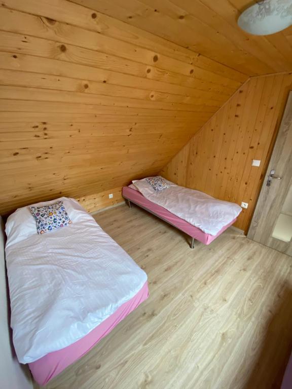 Postel nebo postele na pokoji v ubytování Przystanek Kaszuby