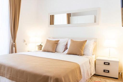 Ένα ή περισσότερα κρεβάτια σε δωμάτιο στο Camelia Luxury Apartments