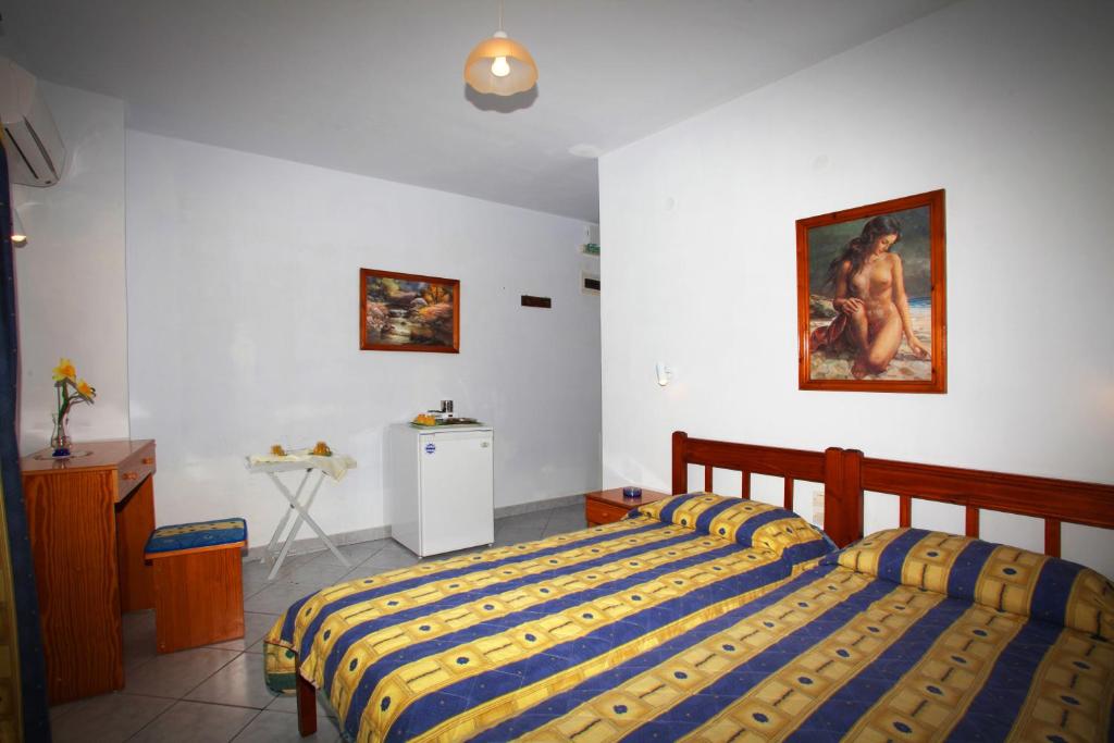 Postel nebo postele na pokoji v ubytování Alexandros Rooms & Studios