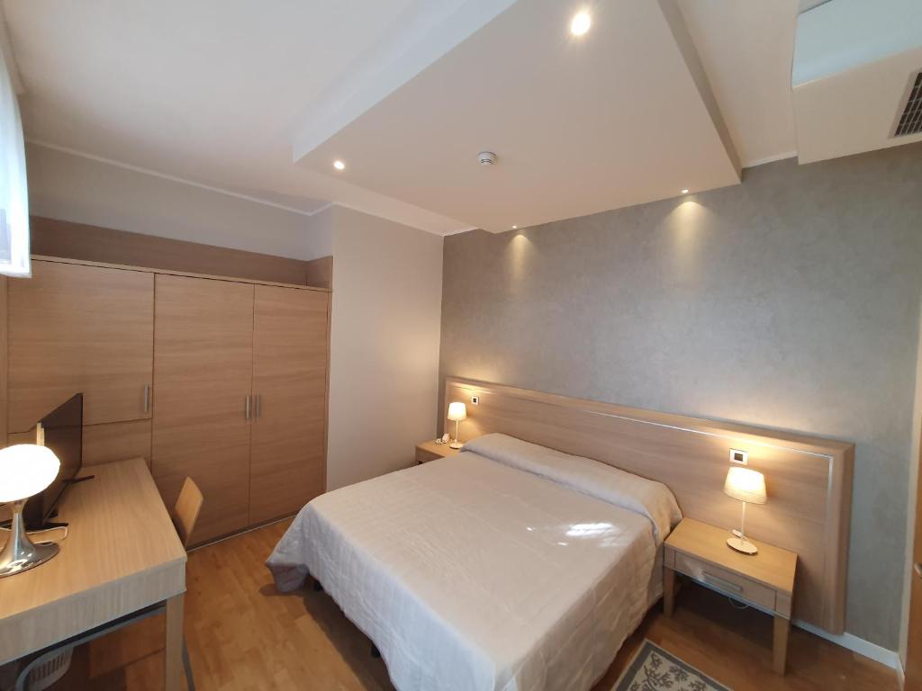 Postel nebo postele na pokoji v ubytování Hotel Eurovil Garni