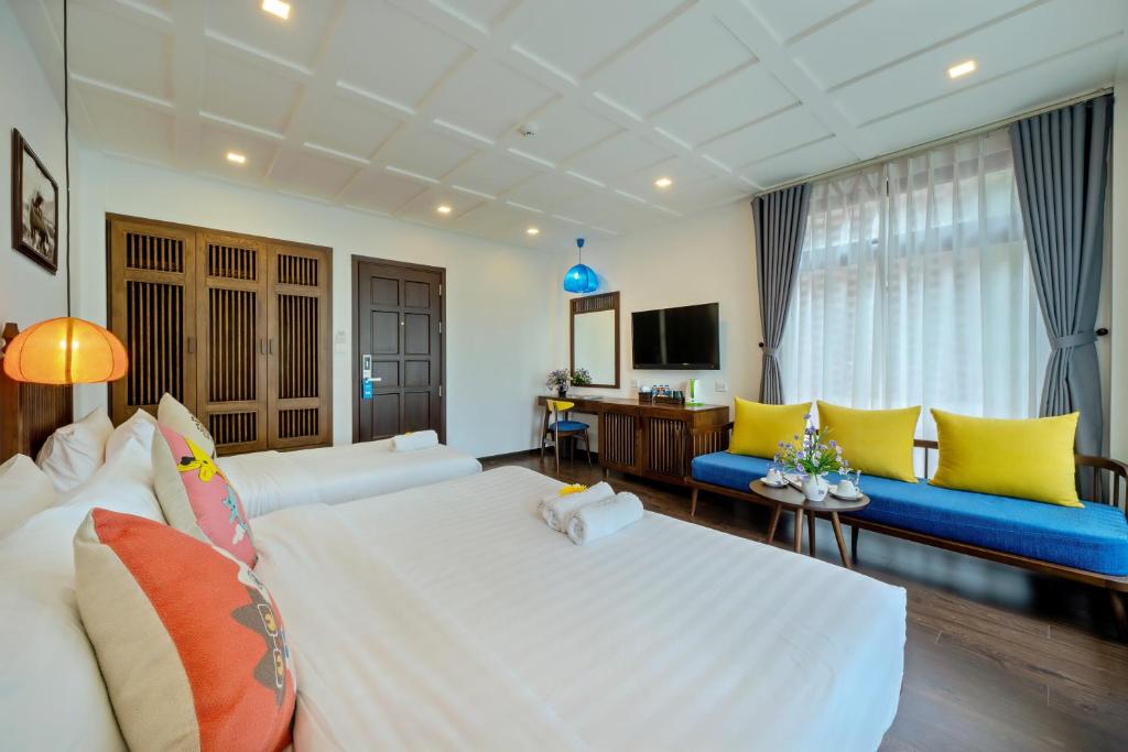 TV a/nebo společenská místnost v ubytování Son Trang Hotel Hoi An