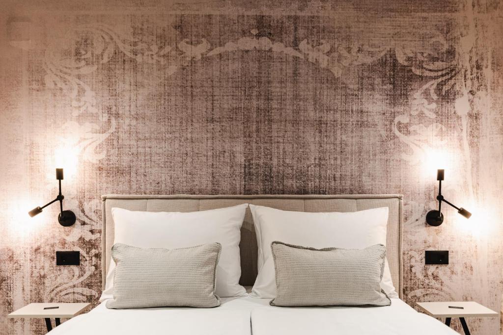 Postel nebo postele na pokoji v ubytování Amoretta rooms