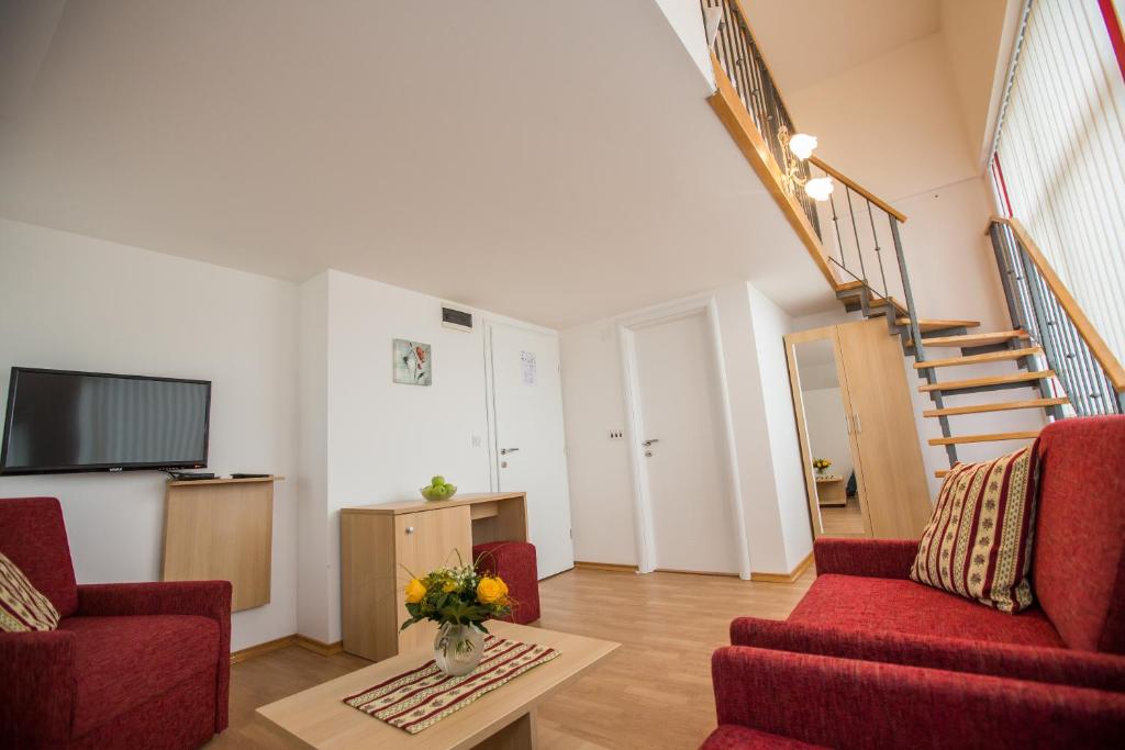TV i/ili zabavni centar u objektu Apartments and Rooms Millennium