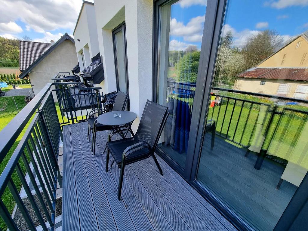 Balkón alebo terasa v ubytovaní Domek pod świerkami - "Apartamenty świerkowe"