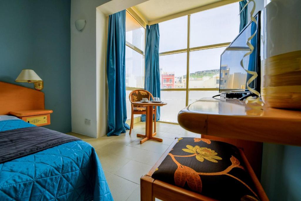 Postel nebo postele na pokoji v ubytování La Playa Hotel