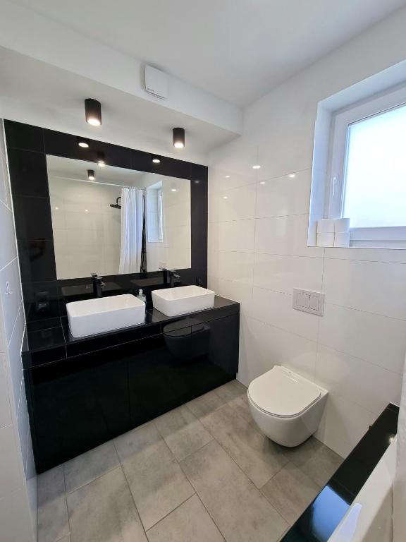 Kúpeľňa v ubytovaní Domek pod świerkami - "Apartamenty świerkowe"