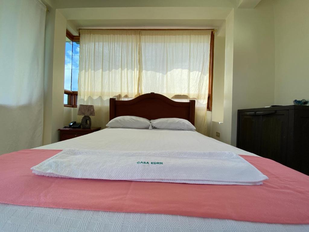 Postel nebo postele na pokoji v ubytování Hostal Casa Edén