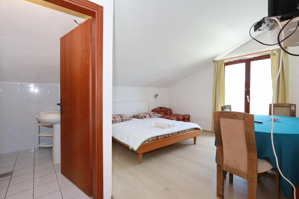 Posteľ alebo postele v izbe v ubytovaní Apartmani Stanka & Joso