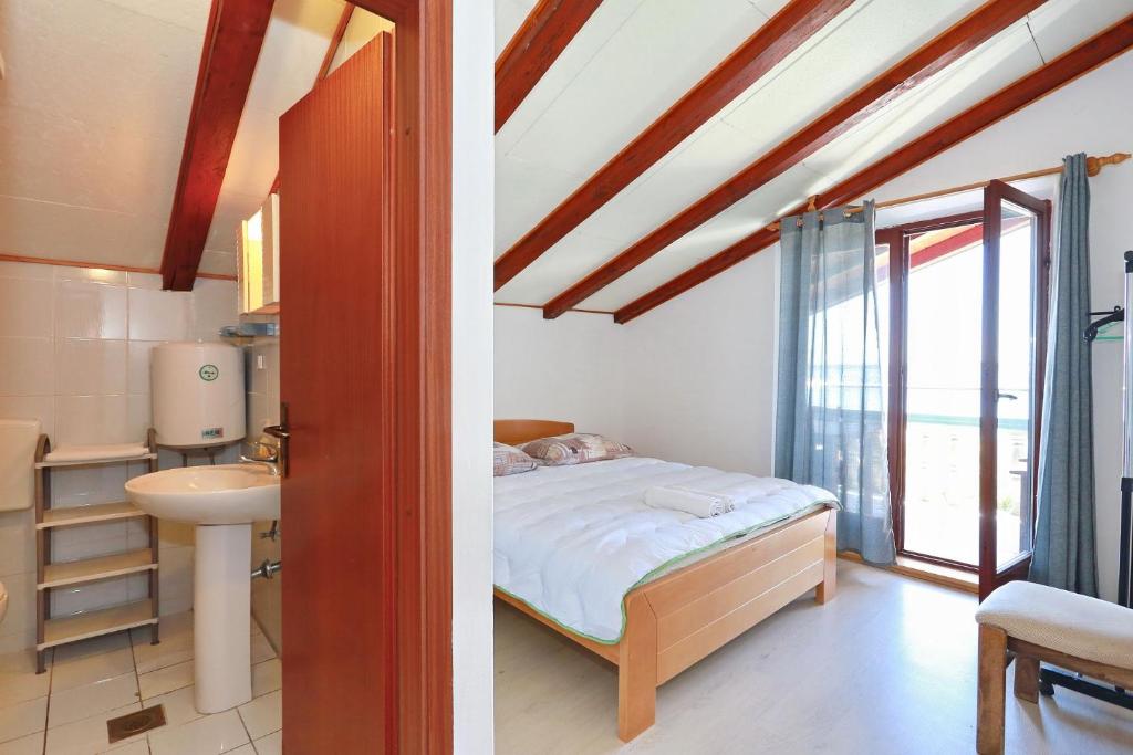 Posteľ alebo postele v izbe v ubytovaní Apartmani Stanka & Joso