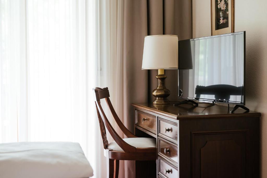 TV a/nebo společenská místnost v ubytování Hotel Isabella