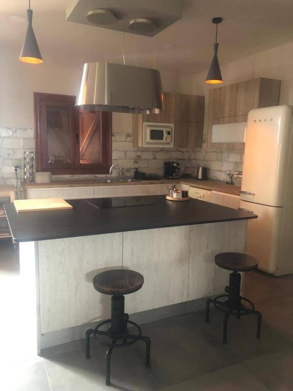 Kuchyň nebo kuchyňský kout v ubytování Casa-Grima