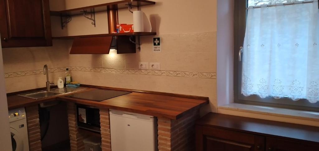 Kuchyň nebo kuchyňský kout v ubytování Apartment Nonna Delia