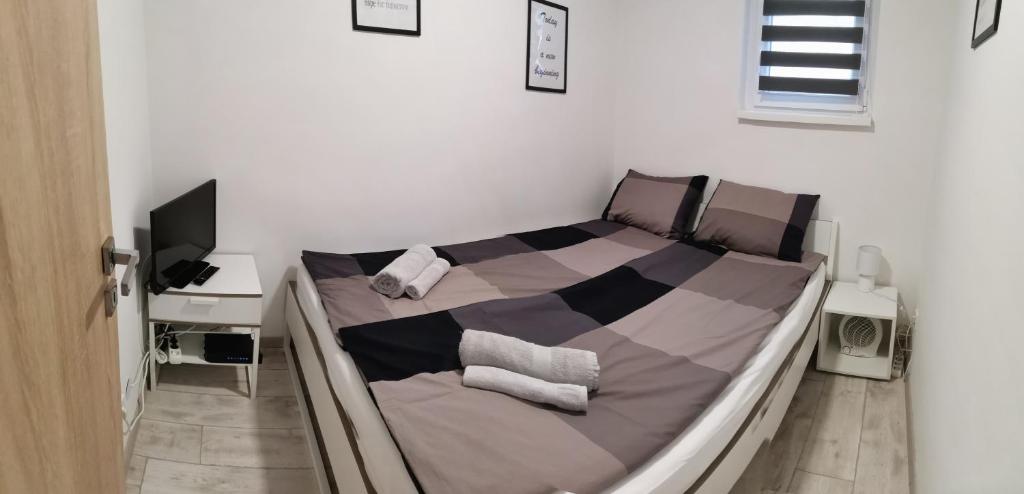 Postel nebo postele na pokoji v ubytování Ady Apartmanház