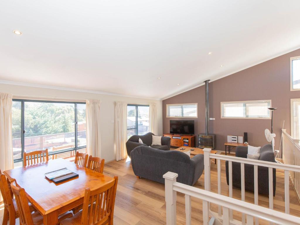 a living room with a couch and a table at Acacia 5 2 Kirwan Close in Jindabyne