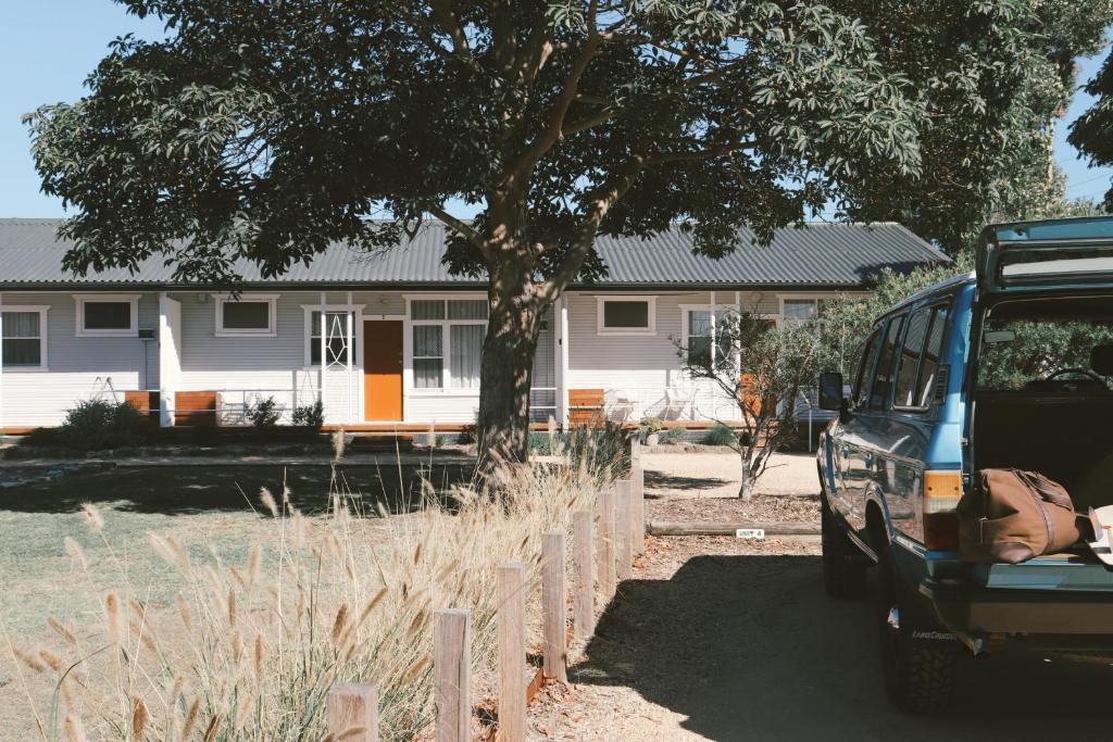 a car parked in front of a house at Mystics Beach Bungalows in Minnamurra