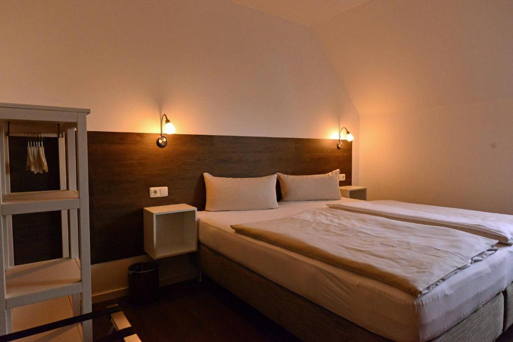 Letto o letti in una camera di Hotel Weinert