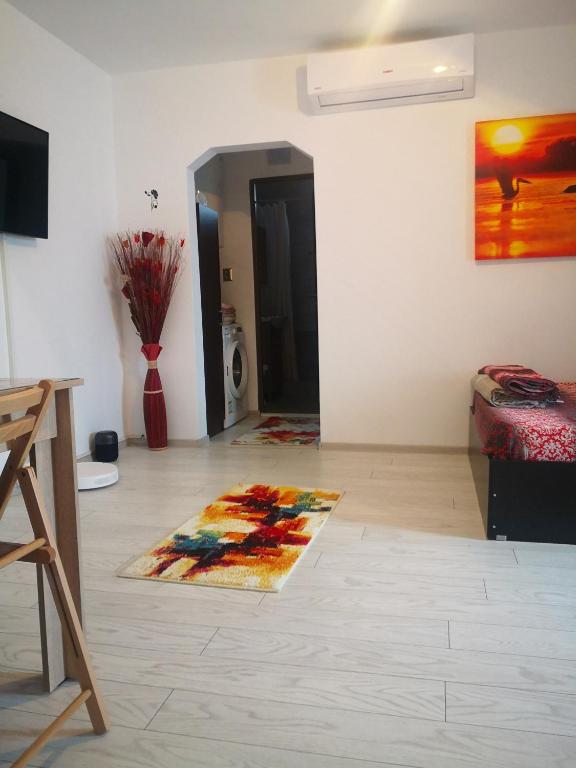 a living room with a rug on the floor at Apartament la dudu in Sulina