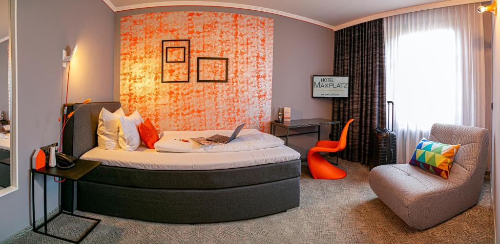 Postel nebo postele na pokoji v ubytování Hotel Maxplatz