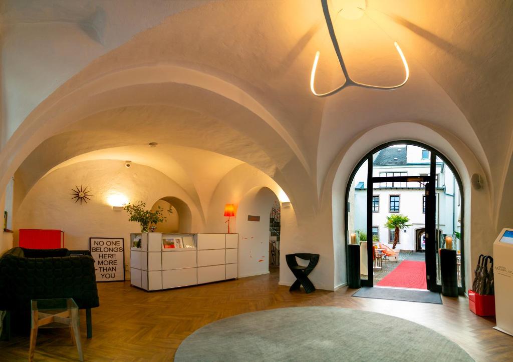 a large room with a large archway in a building at Hotel Maxplatz in Hof