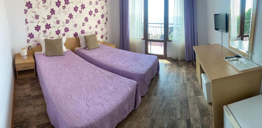 Postel nebo postele na pokoji v ubytování Family Hotel Rai-Only Adults