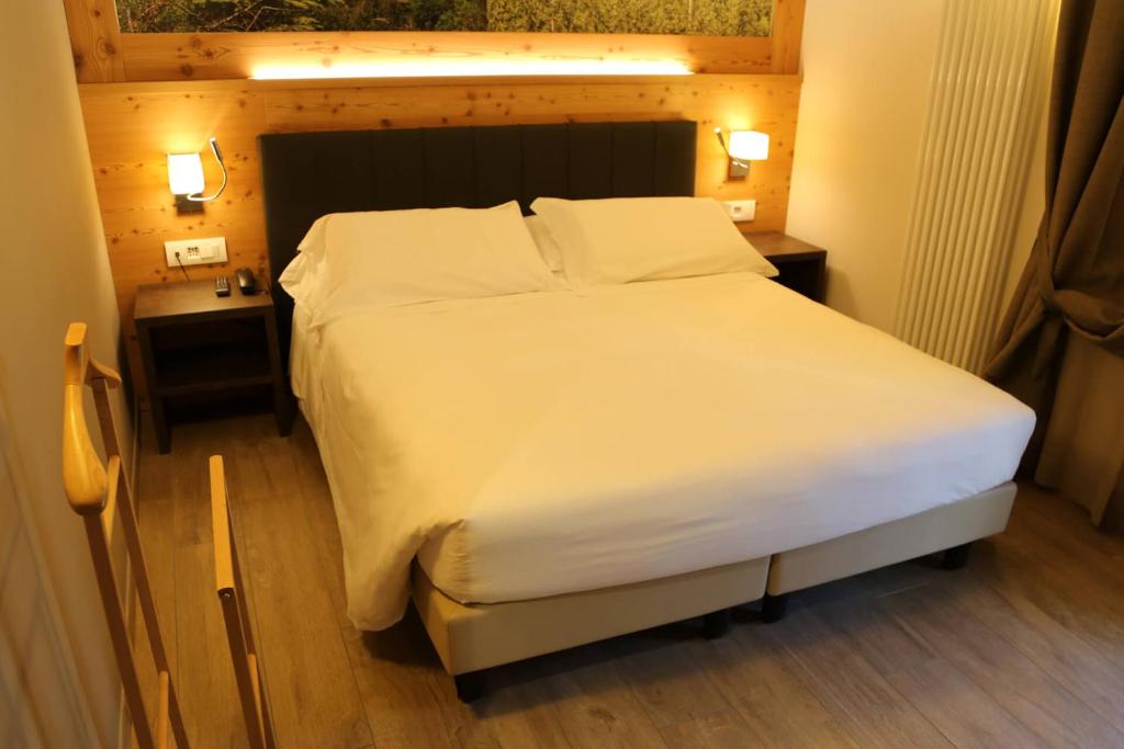 Postel nebo postele na pokoji v ubytování Dada Mountain Hotel