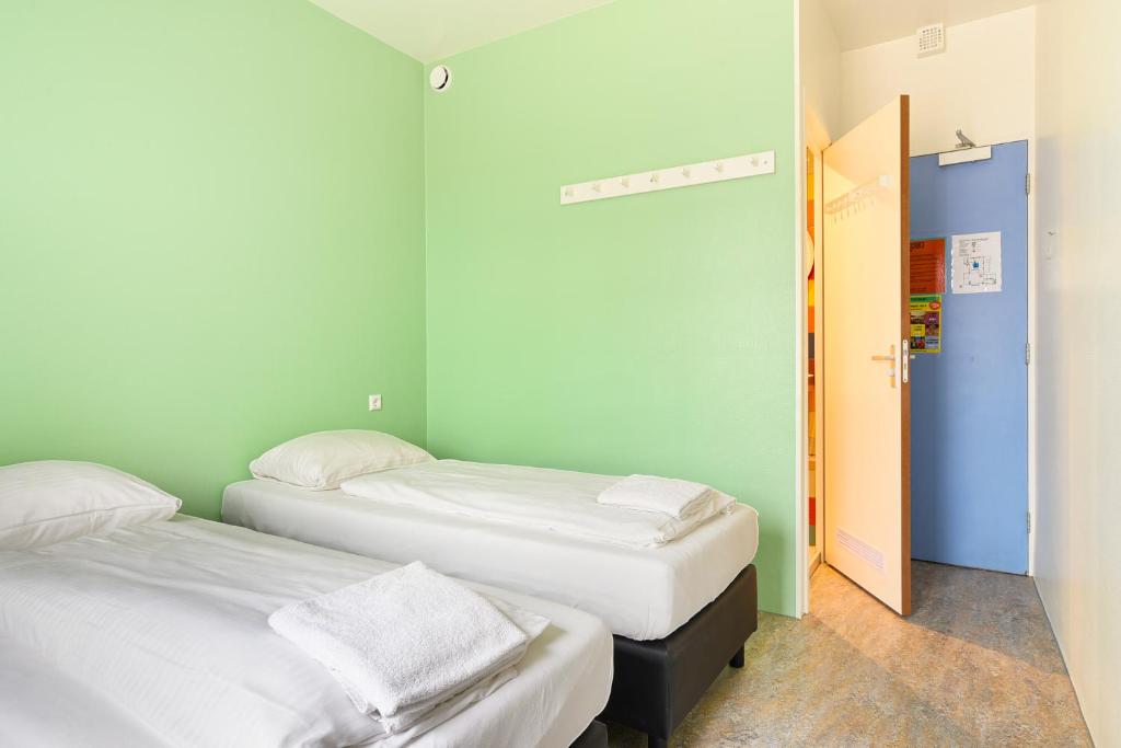Postel nebo postele na pokoji v ubytování Hans Brinker Hostel Amsterdam