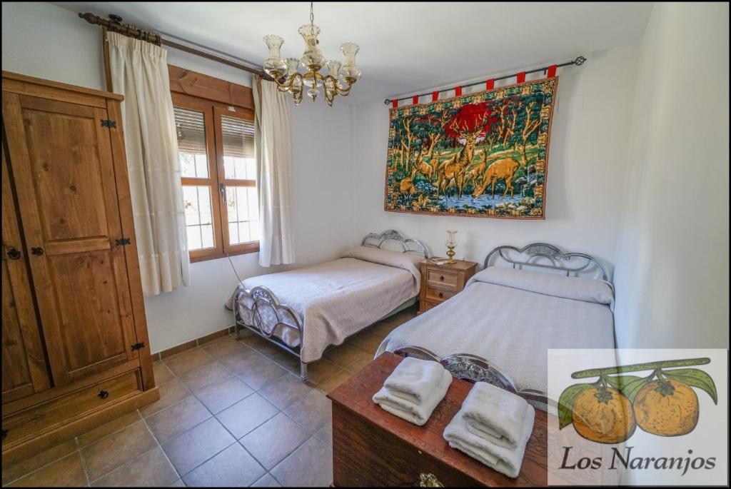 Posteľ alebo postele v izbe v ubytovaní Hostal y Apartamento Rural Los Naranjos