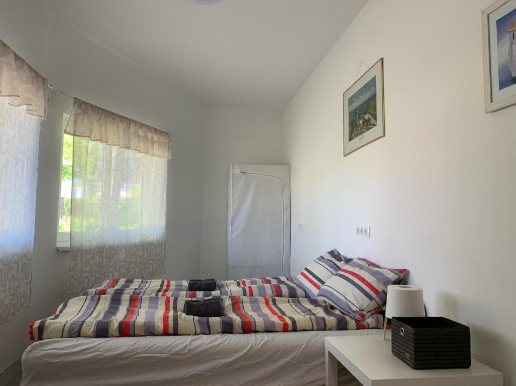 Posteľ alebo postele v izbe v ubytovaní Levendulakert Siófok Apartmanház