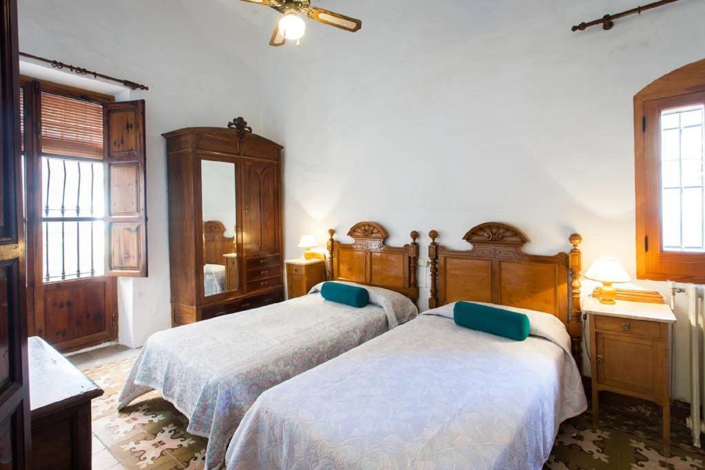 Postel nebo postele na pokoji v ubytování Villa Charly Casa señorial XVII Historical Villa
