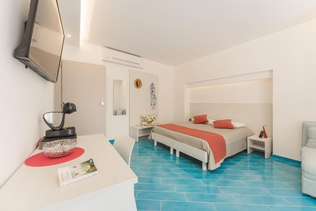 Voodi või voodid majutusasutuse Il Corallo Residence toas