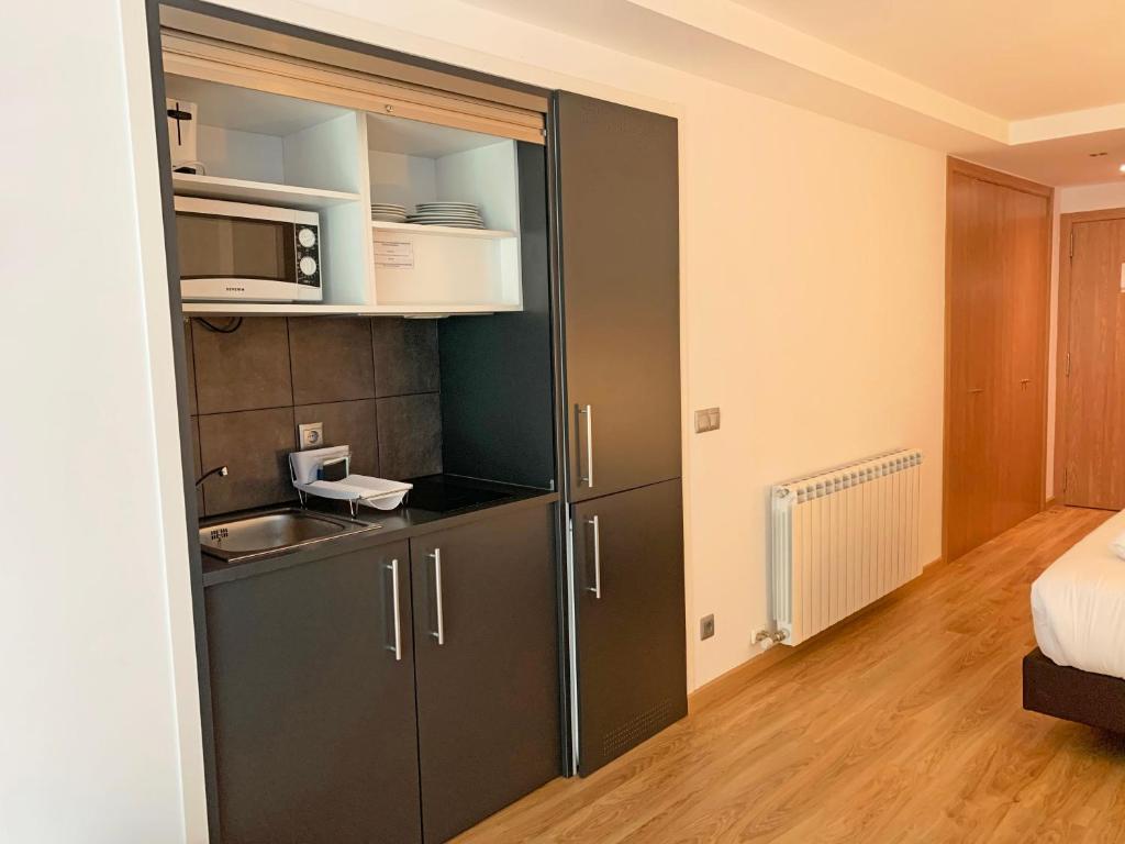 Kuchyň nebo kuchyňský kout v ubytování Apartamentos Vallnord 3000
