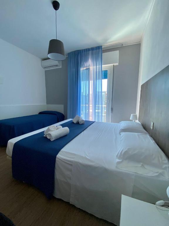 Postel nebo postele na pokoji v ubytování Hotel Danieli
