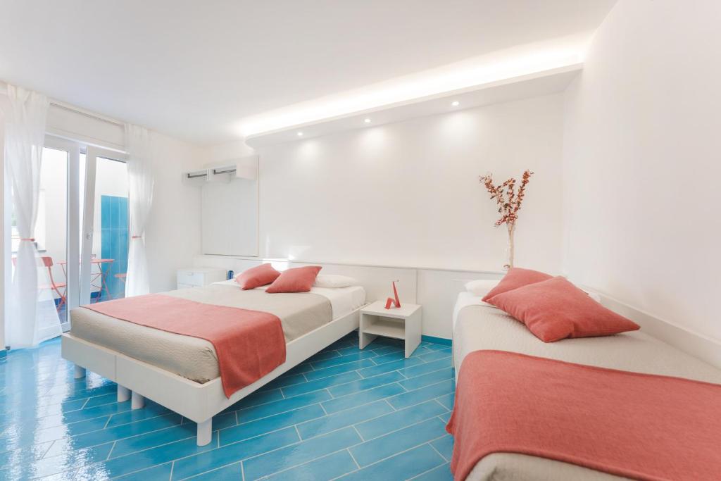 Voodi või voodid majutusasutuse Il Corallo Residence toas