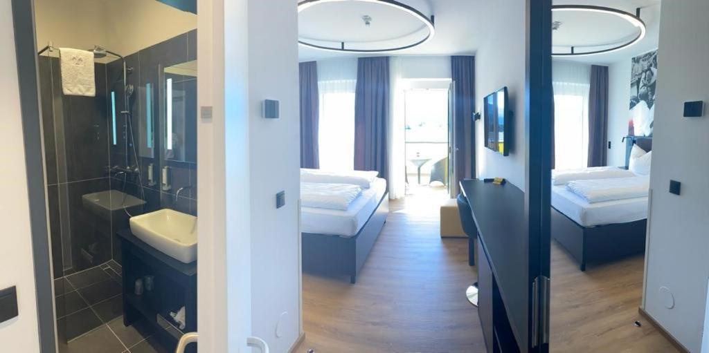 A bed or beds in a room at RINGRAST das Erlebnishotel beim Red Bull Ring