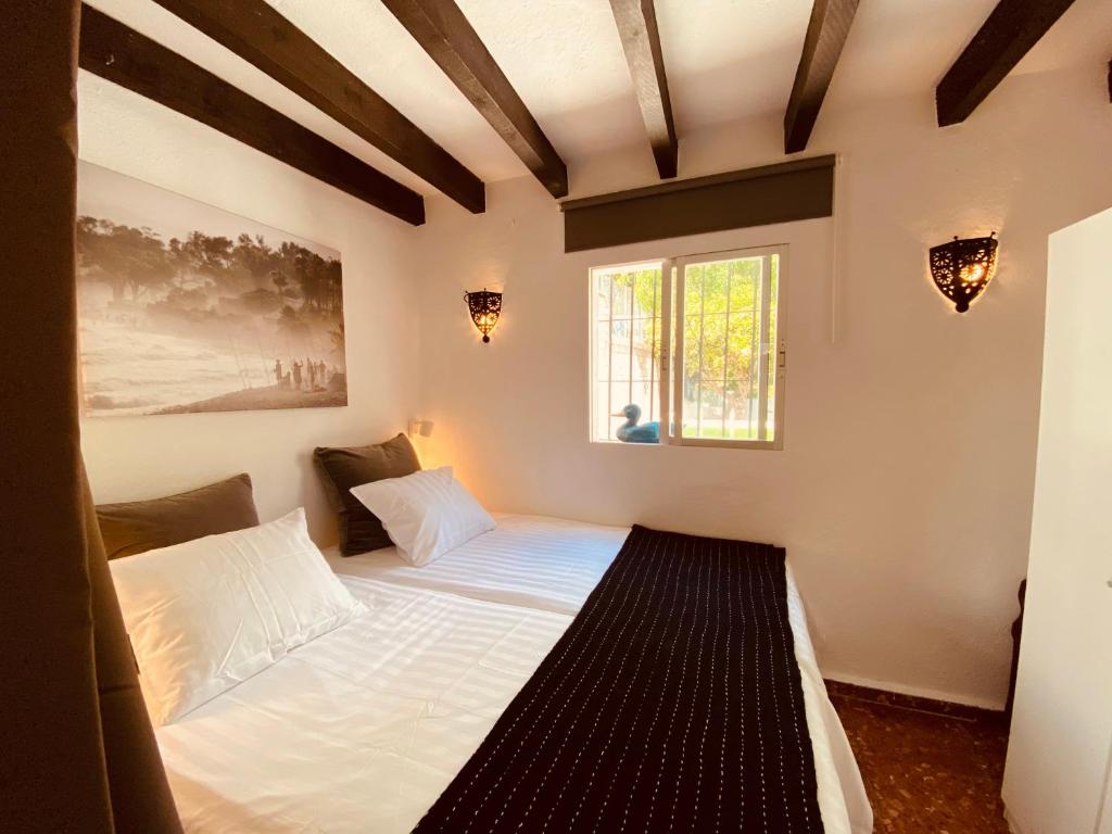 מיטה או מיטות בחדר ב-Finca Flores