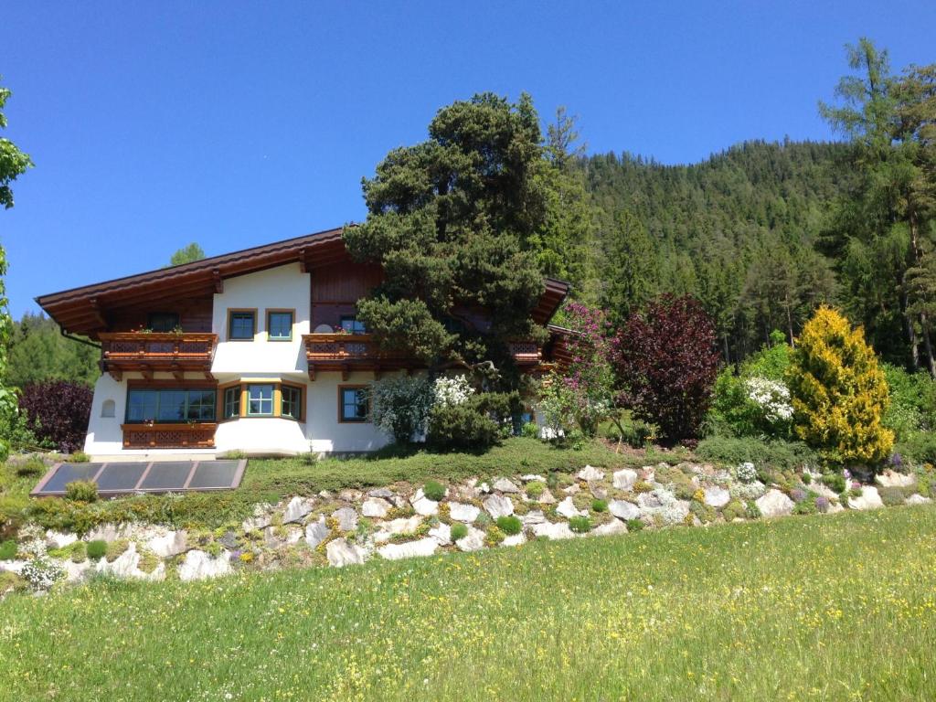 a house in the middle of a field at Appartement Sonnberg in Forstau