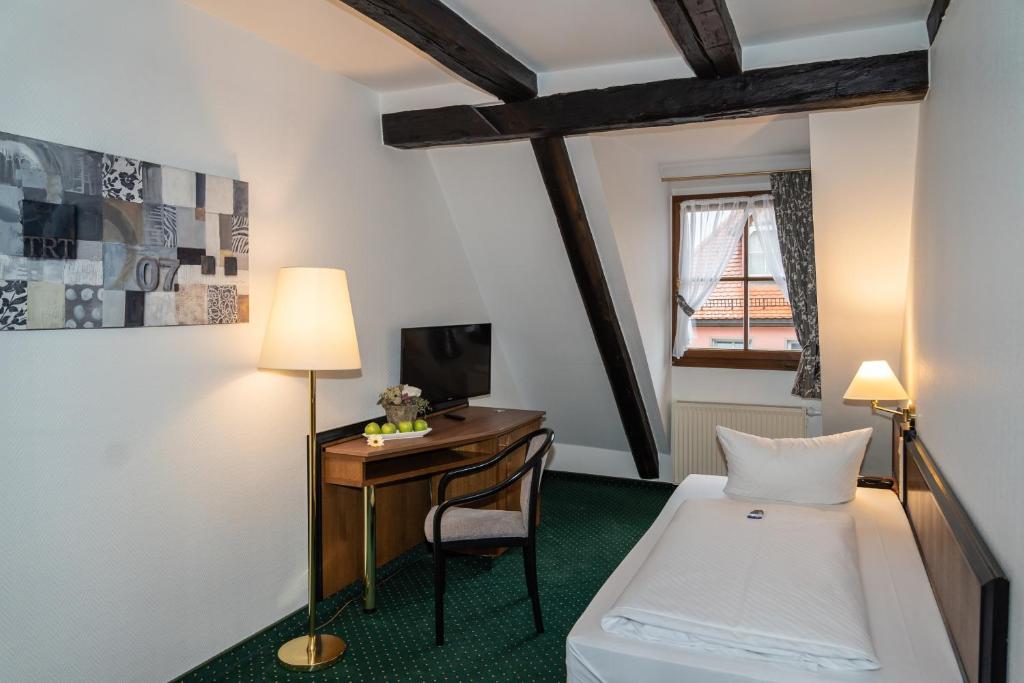 Postel nebo postele na pokoji v ubytování Ringhotel Schlossberg