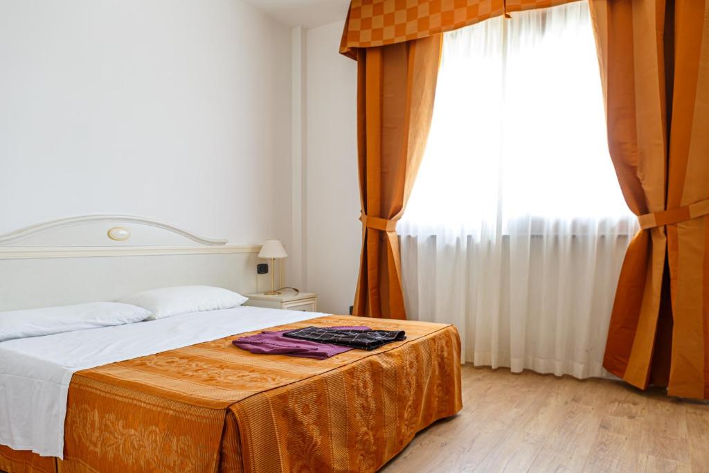 Postel nebo postele na pokoji v ubytování Hotel Villa Sofia