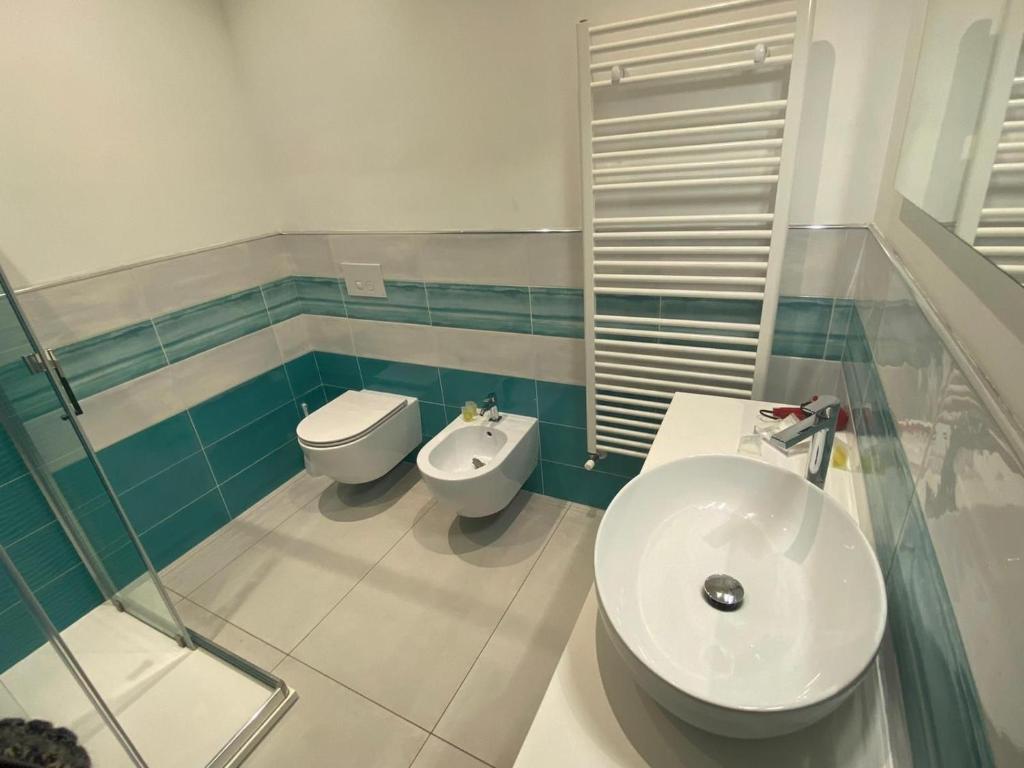 a bathroom with a sink and a toilet at 103 Boutique Hotel Stintino in Stintino