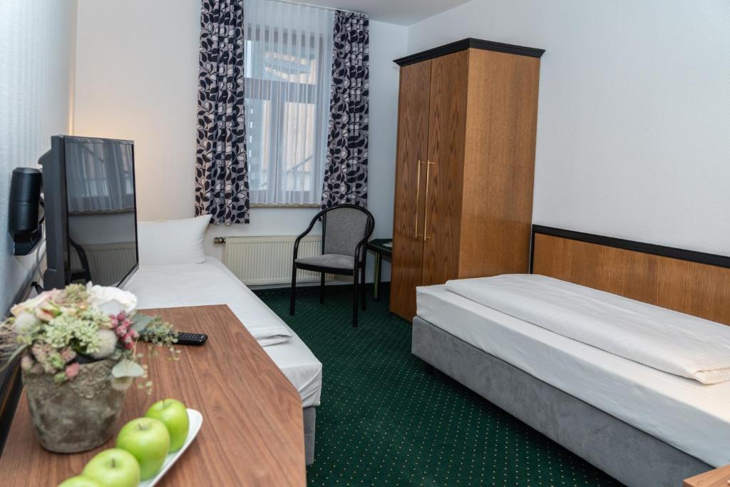 Postel nebo postele na pokoji v ubytování Ringhotel Schlossberg