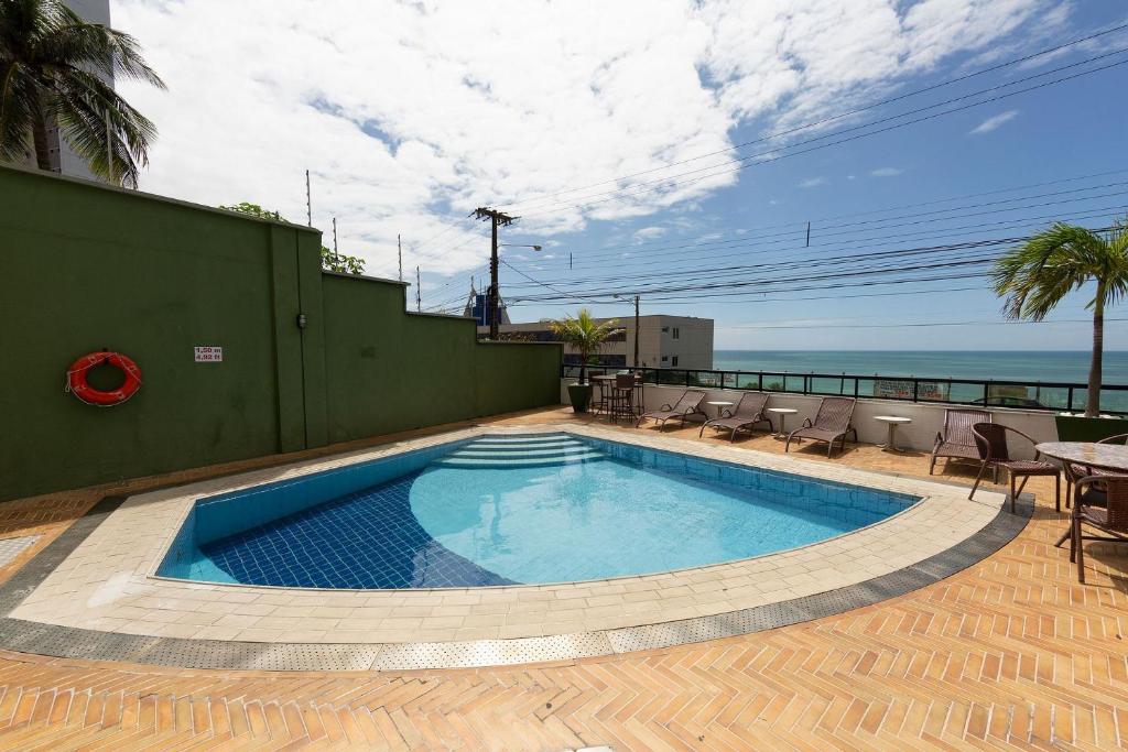  Confortável suíte com vista mar em Ponta Negra por Carpediem