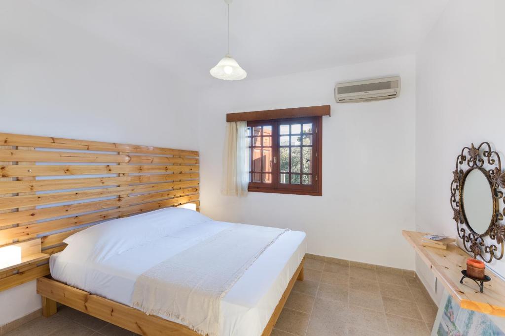 Postel nebo postele na pokoji v ubytování Emerald Dawn Villa