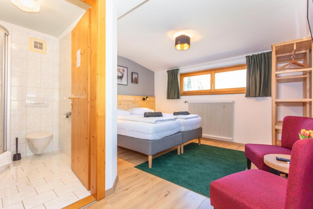 Postel nebo postele na pokoji v ubytování Sonnberg Lodge